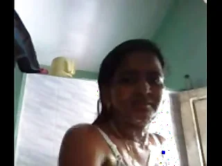 Indian girl taking self glaze when bathing